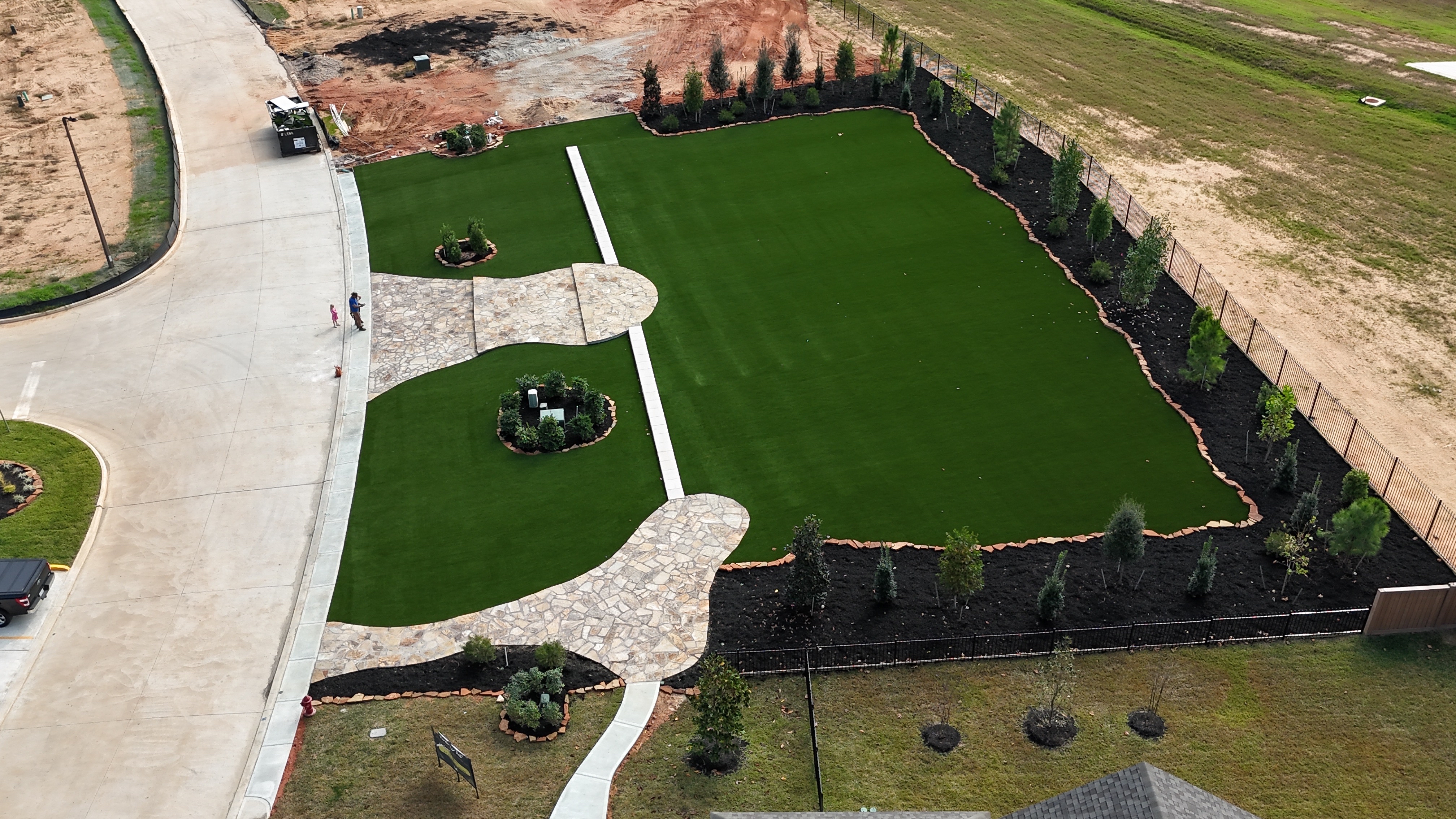 Aerial view of EZ Par artificial turf, landscape design and stonework project